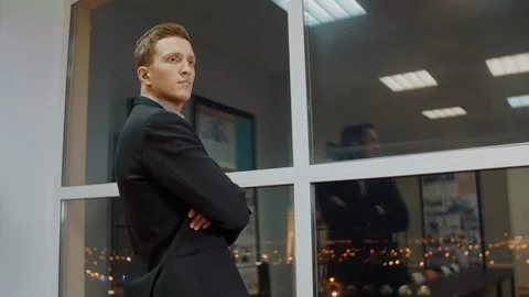 Serious businessman thinking about solve of business problem in evening office Stock-Footage 98757123