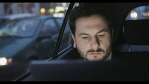 Serious Businessman Using a Tablet in a Traffic Jam Stock Footage 74495999