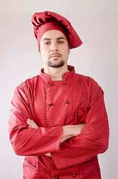 Serious chef posing in studio shot Stock Photos