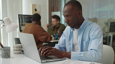 Serious Coder Testing Application on Laptop at Office Stock Footage 277413137