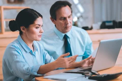 Serious colleagues preparing project presentation Stock Photos