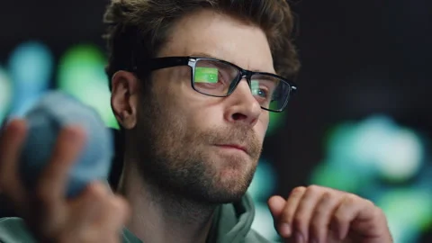 Serious computer scientist working in data center closeup. IT man holding ball Stock Footage 260256161