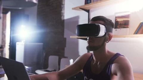 Serious, concentrated scientist using new device. Portrait of young man in Stock Footage 98178836