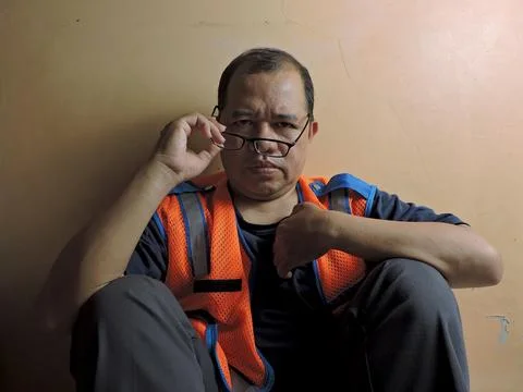 Serious Construction Worker Looking Through Glasses Stock Photos