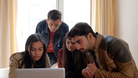Serious contemplation and work ethnic leads of Indian colleagues celebrating the Stock Footage 101174617