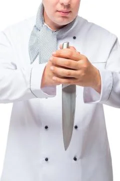 Serious cook with a very sharp knife in his hands on a white background Stock Photos