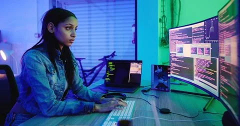 Serious developer, code and computer screen in neon programming, cybersecurity Stock Photos