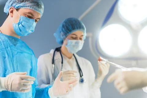 Serious doctors ready for operation Foto stock