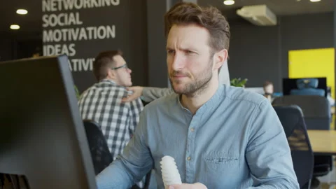 Serious engineer examining detail and using computer Stock-Footage 151629197