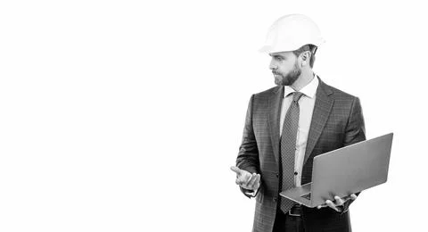 Serious engineer man in hardhat and suit use laptop computer for constructing Stock Photos