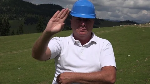 Serious Engineer Salute with a Welcome Hand Gesture. Video stock 69743792