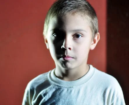 Serious face of a small boy Stock Photos