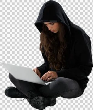 Serious female hacker using laptop while sitting Stock Photos