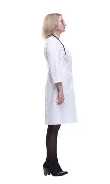 Serious female medic looking at a white screen. isolated on a white 스톡 사진