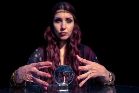 Serious fortune teller using crystal ball Stock Photos