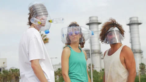 Serious Group of Friends looking at the camera. Covering Faces with Plastic Vídeos de archivo 131289206