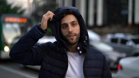 Serious Guy Looking at Camera in city background Stock Footage 89728904