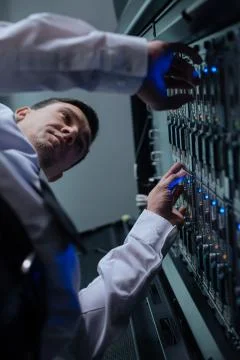 Serious hard working programmer doing his job Stock-Fotos