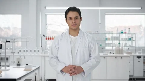 Serious Indian scientist looking at the camera Stock Footage 252948777