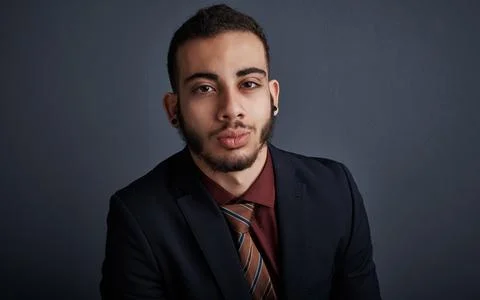 Serious, intern and man in studio with portrait, pride and skill developmen.. Stock Photos