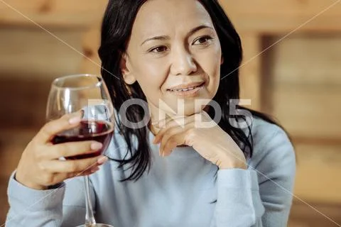 Serious lady waiting for important news Stock Photos