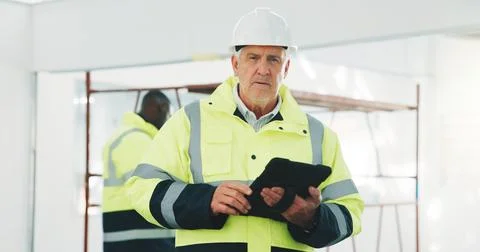 Serious, man and engineer at site with tablet, career pride and about us for 写真素材