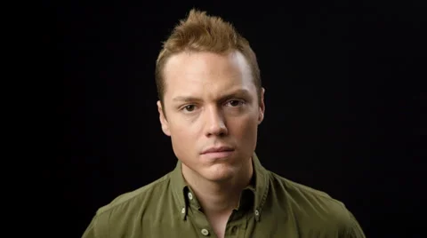 Serious man, black background Video stock 42240998