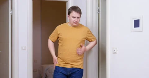 Serious man changes his mind, waves away with a smile and tries to find Stock Footage 219371236