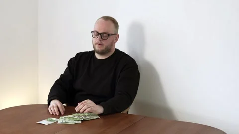 Serious Man Counting Cash at Table Financial Problem Budget Stress Not Enough Stock Footage 333538605