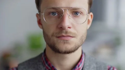 Serious man in eyeglasses looking at camera Stock Footage 142534688