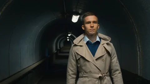 Serious man going through the tunnel Stock Footage 112037529