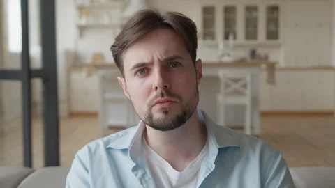 Serious Man Looking At Camera With Thoughtful And Concerned Expression Vídeos de archivo 344696440