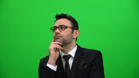 Serious Man Looking Up on Green Screen Background Stock Footage 88651740