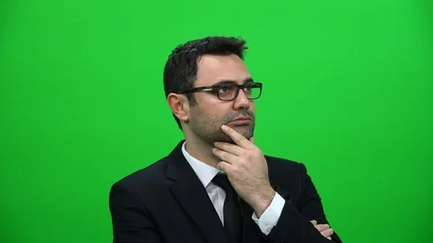 Serious Man Looking Sideways on Green Screen Background Stock Footage 88651742