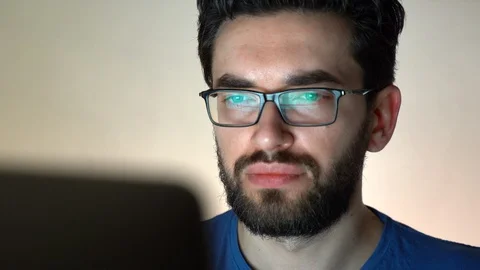 Serious man portrait in glasses working hard at computer Stock Footage 108573833