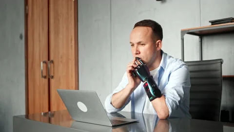Serious man programmer with artificial limb prothesis Stock-Footage 157348052