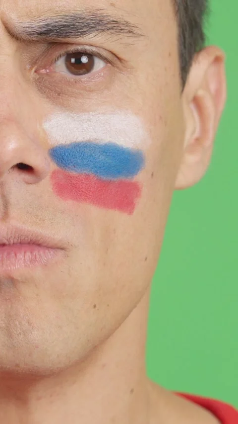 Serious man with a russian flag painted on the face Stock Footage 257325593