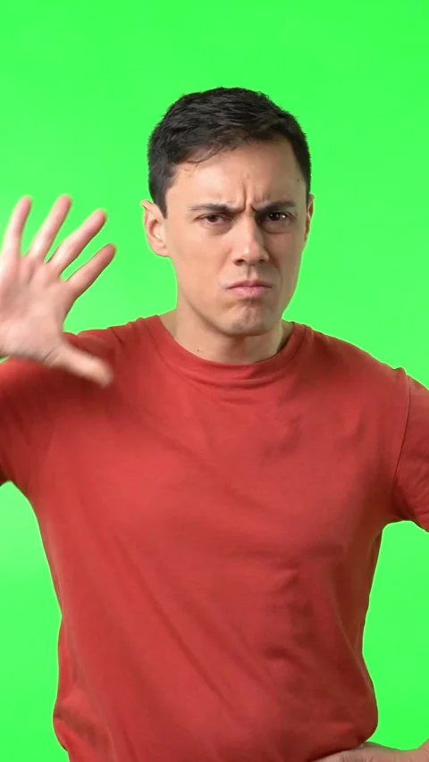 Serious man show gesticulating stop sign and looking at camera Stock Footage 243603918