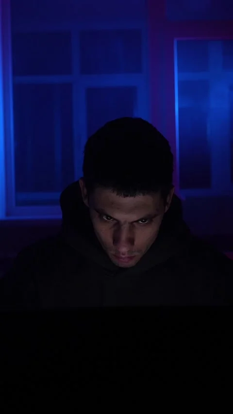 Serious Man Sits Working Laptop Home Night in Neon Lighting. Concept Remote Work Stock Footage 234222893