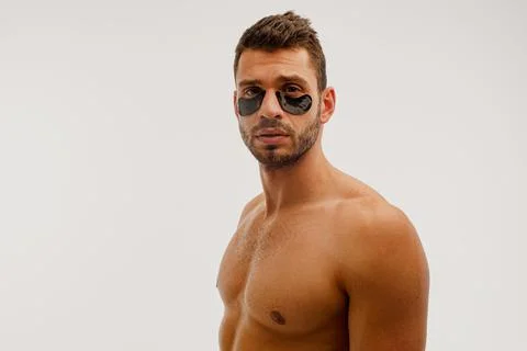 Serious man with under eye patch on face Stock Photos