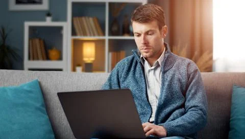 Serious man using laptop 스톡 사진
