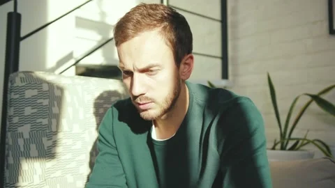 Serious man using laptop sad working from home in internet typing on computer Stock Footage 132537375
