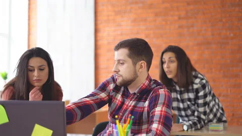 Serious man working at the computer. finds a suitable option on the Internet and Stock Footage 86647010