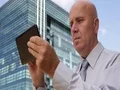 Serious Manager Outside Office Building Accessing Tablet Internet Connection 4k or 4k+ Resolution