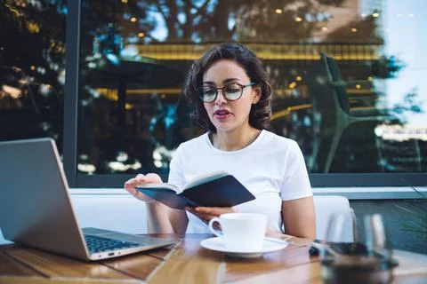 Serious manager reading notes near cafeteria Stock Photos