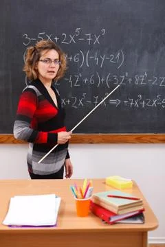 Serious math teacher explaining Stock Photos