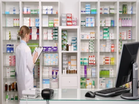 Serious Medic Inventory Working Drugstore Clipboard Noting Typing Computer List Stock Footage