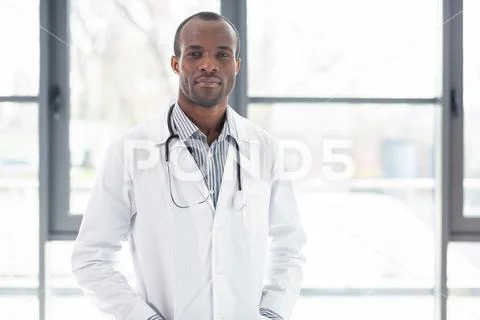 Serious medical worker looking at camera Stock Photos