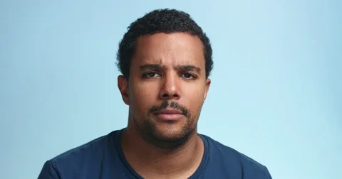 Serious mixed race man could not stand and laughing Stock Footage 78509552