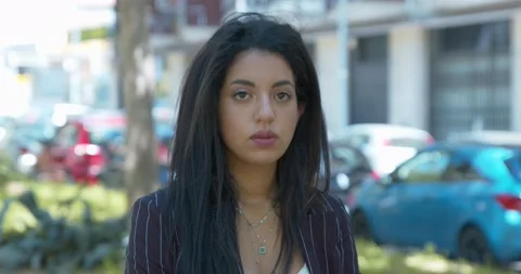 Serious moroccan woman changes expression and smiles at camera Stock Footage 156891439